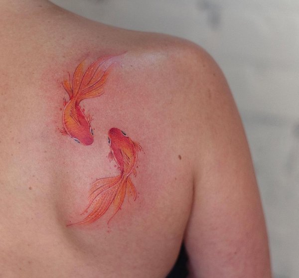 fish tattoos upper back