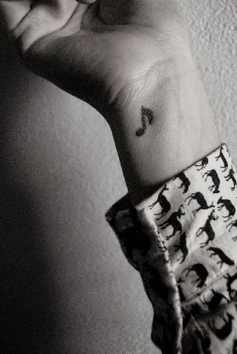 Small Tattoos small music symbol tattoo design on wrist