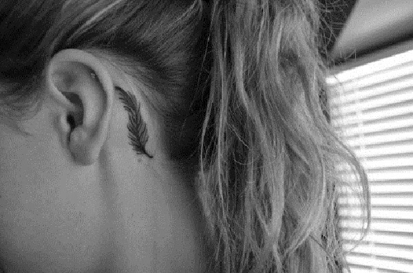Small Tattoos small feather tattoo behind ear