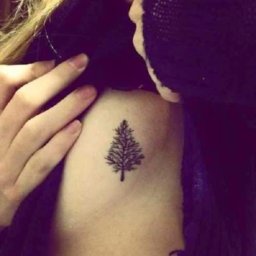 Small Tattoos small tree tattoo design on side rib cage