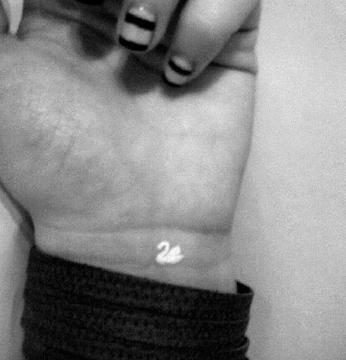 Small Tattoos small bird white ink  tattoo on wrist