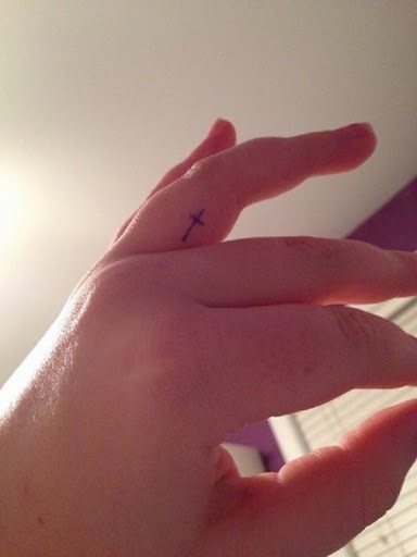 Small Tattoos small cross tattoo on finger