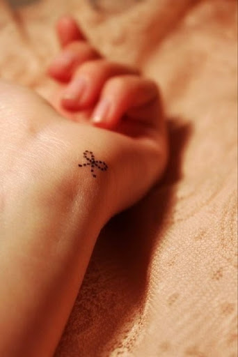 Small Tattoos small bow tattoo on wrist