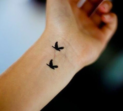 Small Tattoos small flying birds tattoo on wrist