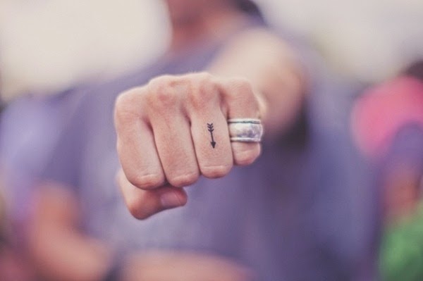 Small Tattoos small arrow tattoo on finger