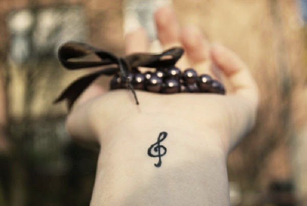 Small Tattoos small music symbol & tattoo on wrist