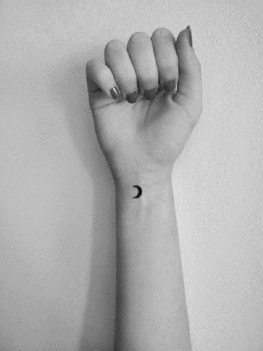 Small Tattoos eclipse moon tattoo on wrist