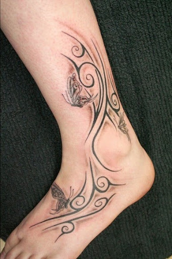tribal tattoos on foot of girls with butterflies