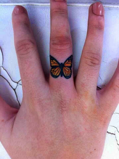 Small Tattoos small butterfly tattoo on finger