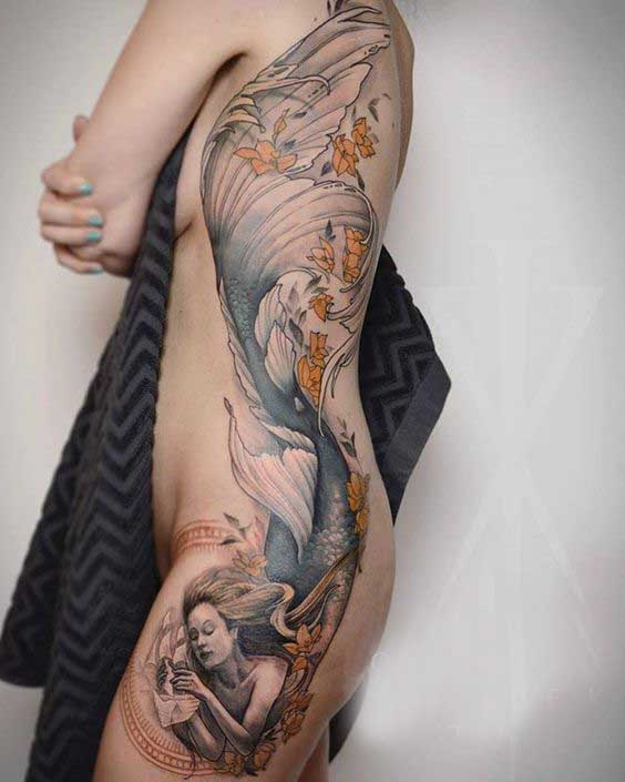 large mermaid tattoo design on side rib