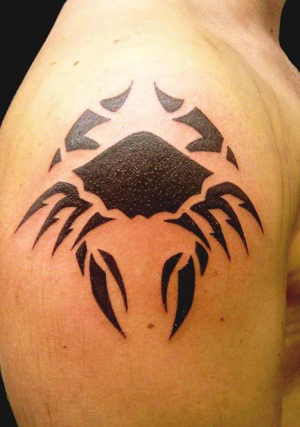 Tribal cancer tattoo design on shoulder