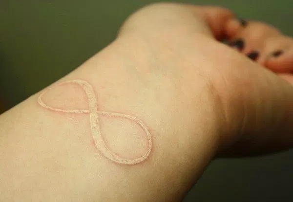 wrist tattoos white ink infinity tattoos on wrist