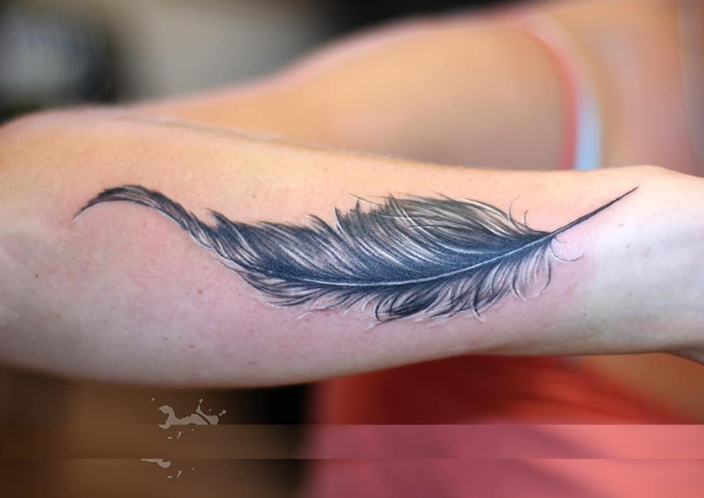 feather tattoos on arm