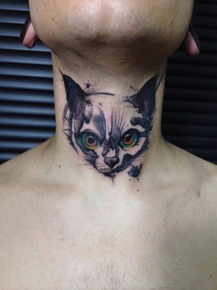 cat tattoo on neck