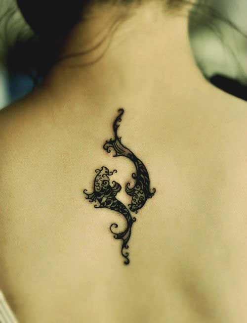 Beautiful pisces tattoo on back