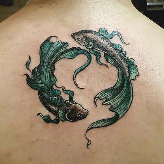 green color pisces tattoos on back