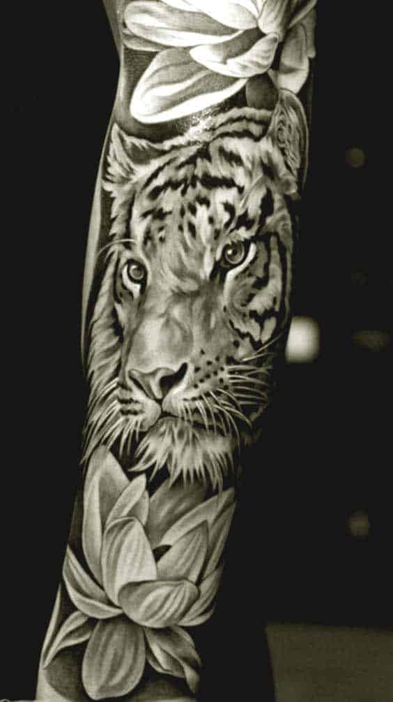 Tiger and lotus flower tattoo on inner arm for men