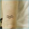 Best Aquarius Tattoos A Symbolic Tribute To The Water Bearer S Significance