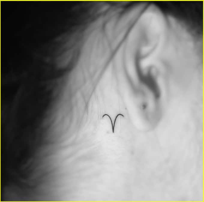 aries symbol tattoo behind ear