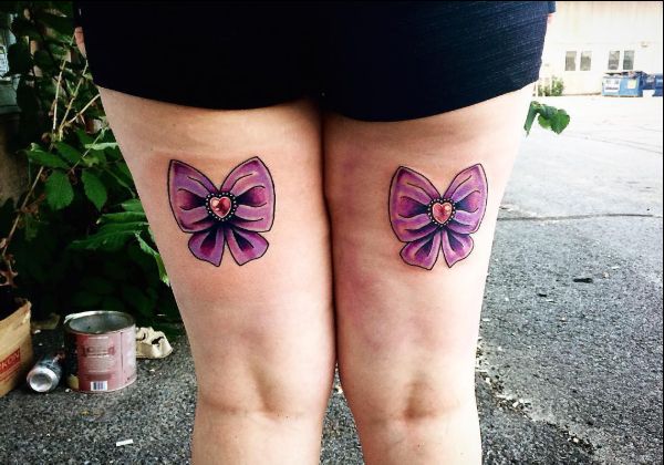 bow tattoos on back of thighs