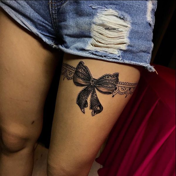 bow tattoos on thigh