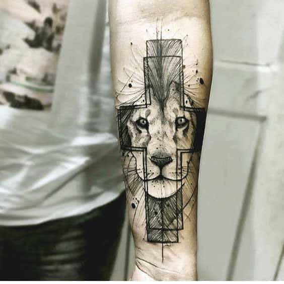 Geometric and cross including lion tattoo