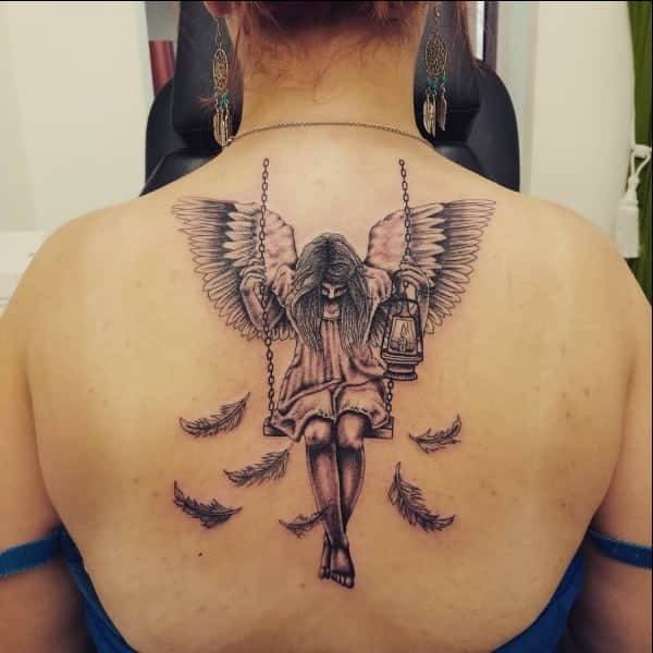 sad angel tattoos on back for girls