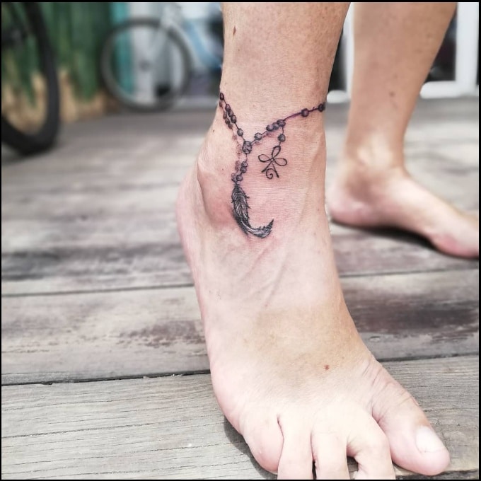 feather ankle tattoos