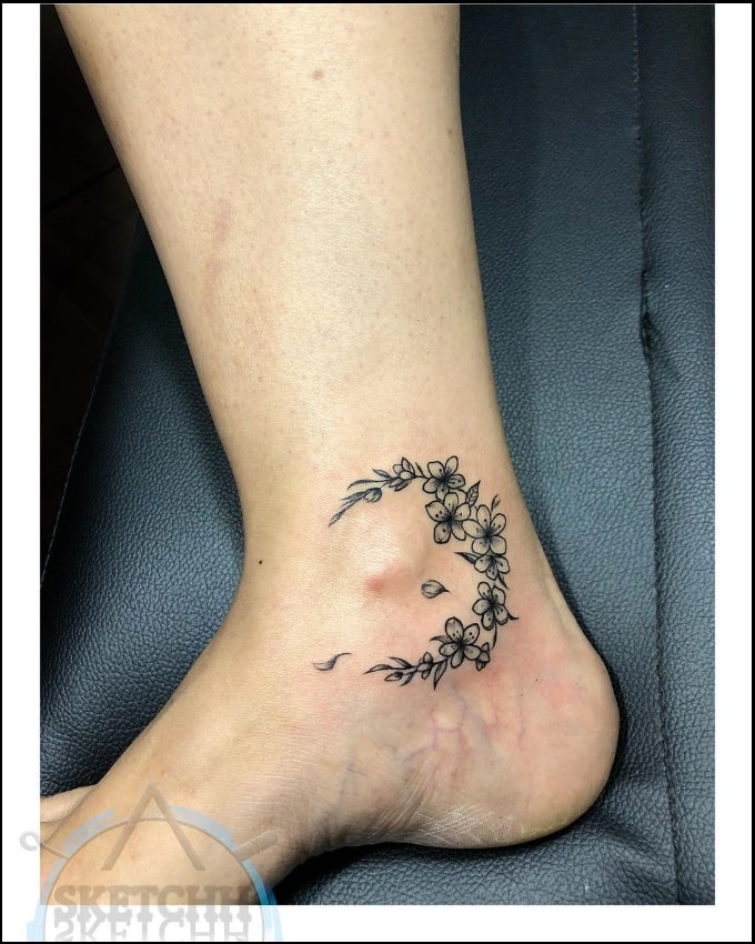 floral moon ankle tattoos