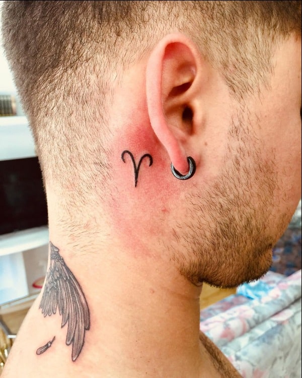 aries symbol tattoo behind ear