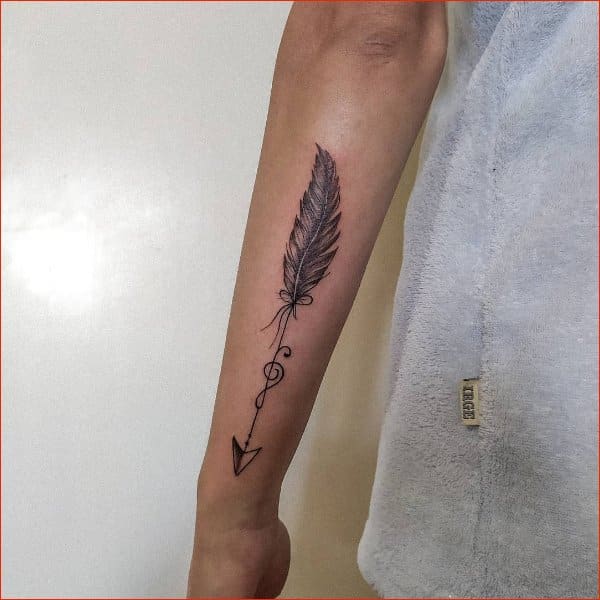 Premium Vector  Arrow with tribal feathers decorative boho indian  arrowhead and feather native aztec or tattoo