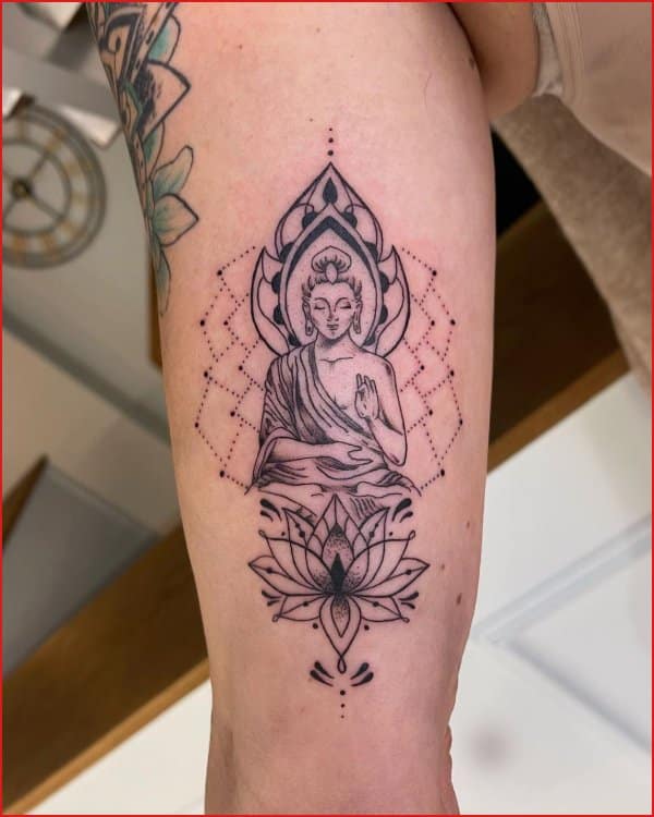 buddha tattoo upper arm