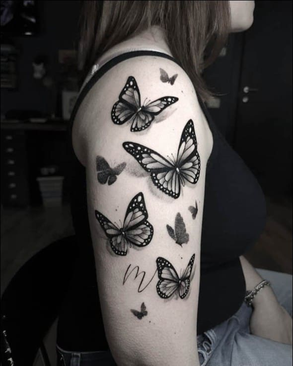 Black and Blue Butterfly Tattoo On Arm Sleeve