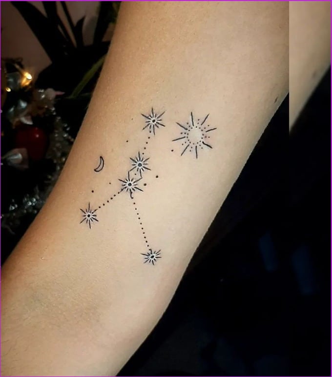 constellation cancer zodiac tattoo on arm for female