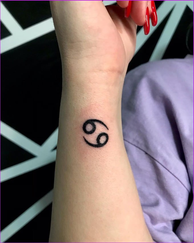 cancer zodiac symbols tattoos on wrist