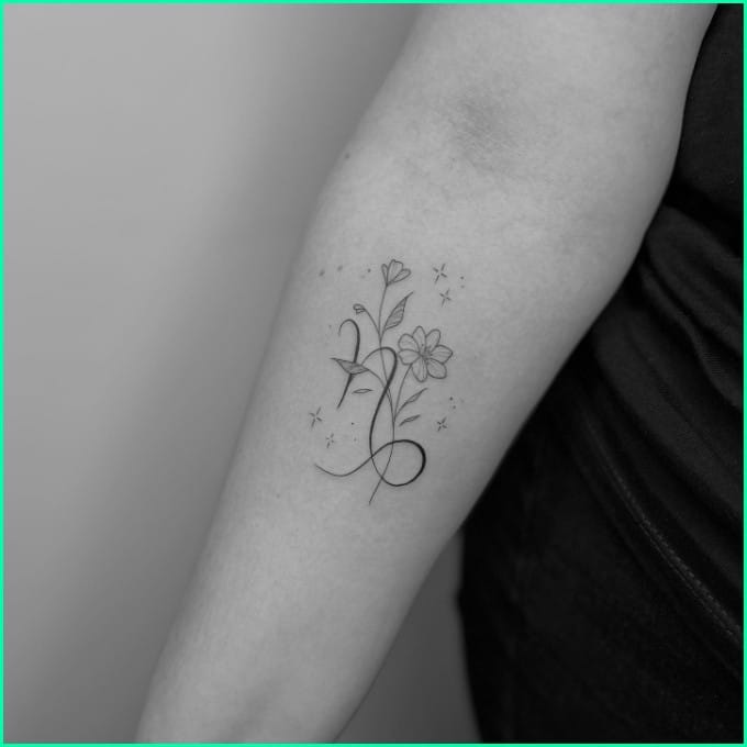 capricorn symbol tattoo with flower