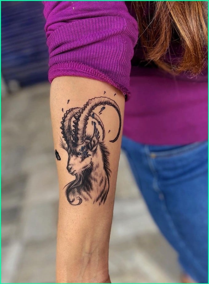 capricorn goat head tattoo on forearm