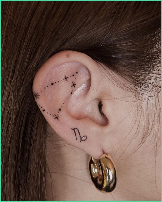 capricorn constellation and symbol tattoo on ear