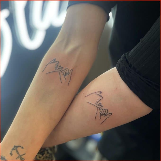 holding hands for couple tattoos