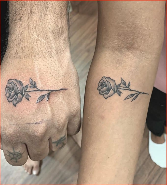 small matching rose tattoos