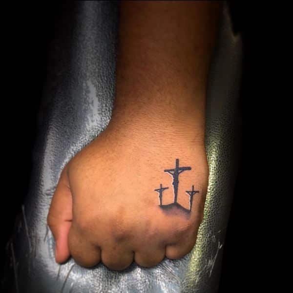 cross tattoos on hands