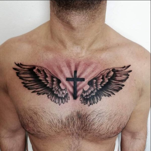 cross tattoos on chest with wings