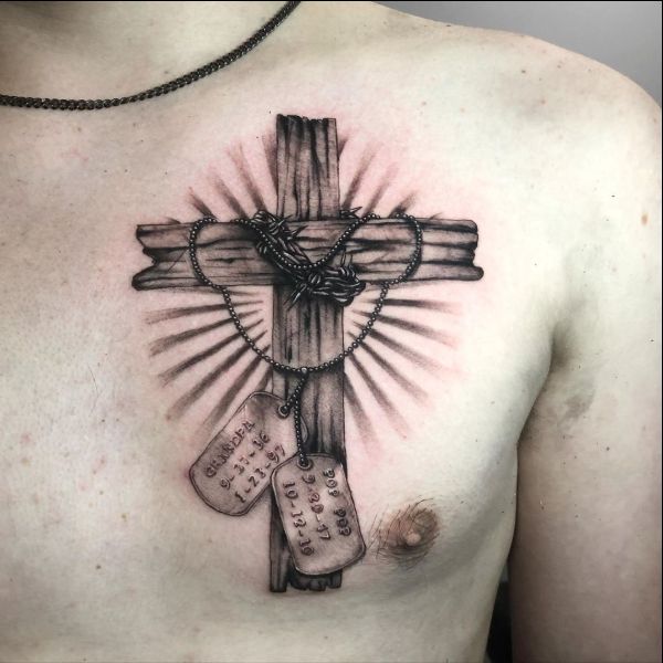 wooden cross tattoos on chest