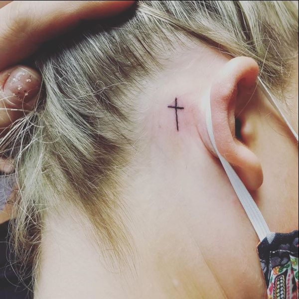 tiny cross tattoos behind the ear