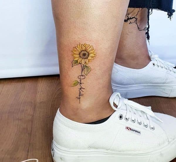 daisy tattoo on leg