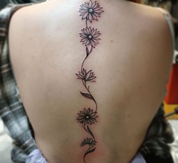 daisy tattoos on spine