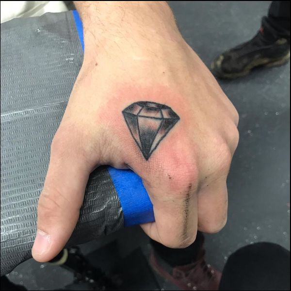 small diamond tattoo on hand