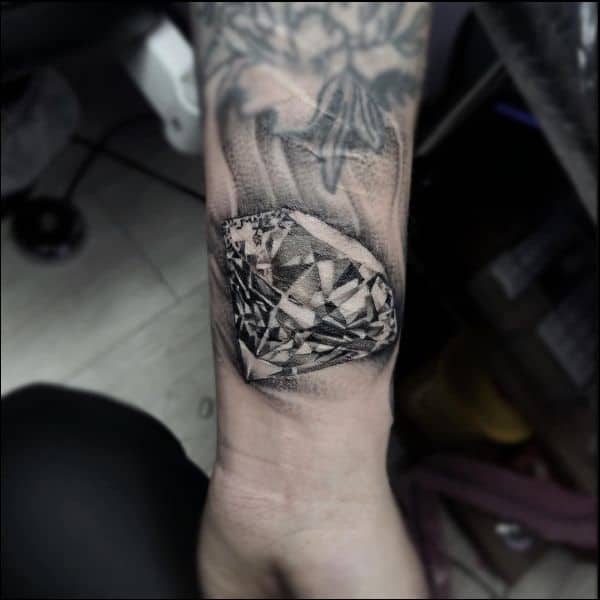 black and grey diamond tattoo on wrist