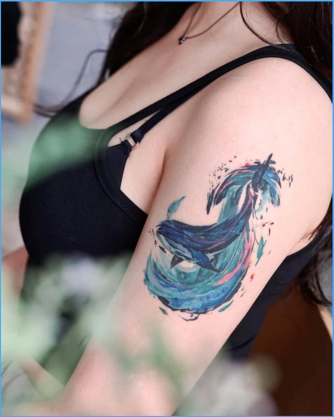 watercolor dolphin tattoos