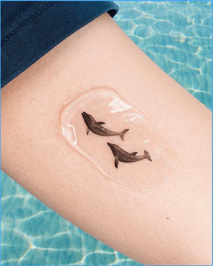 dolphin sister tattoos